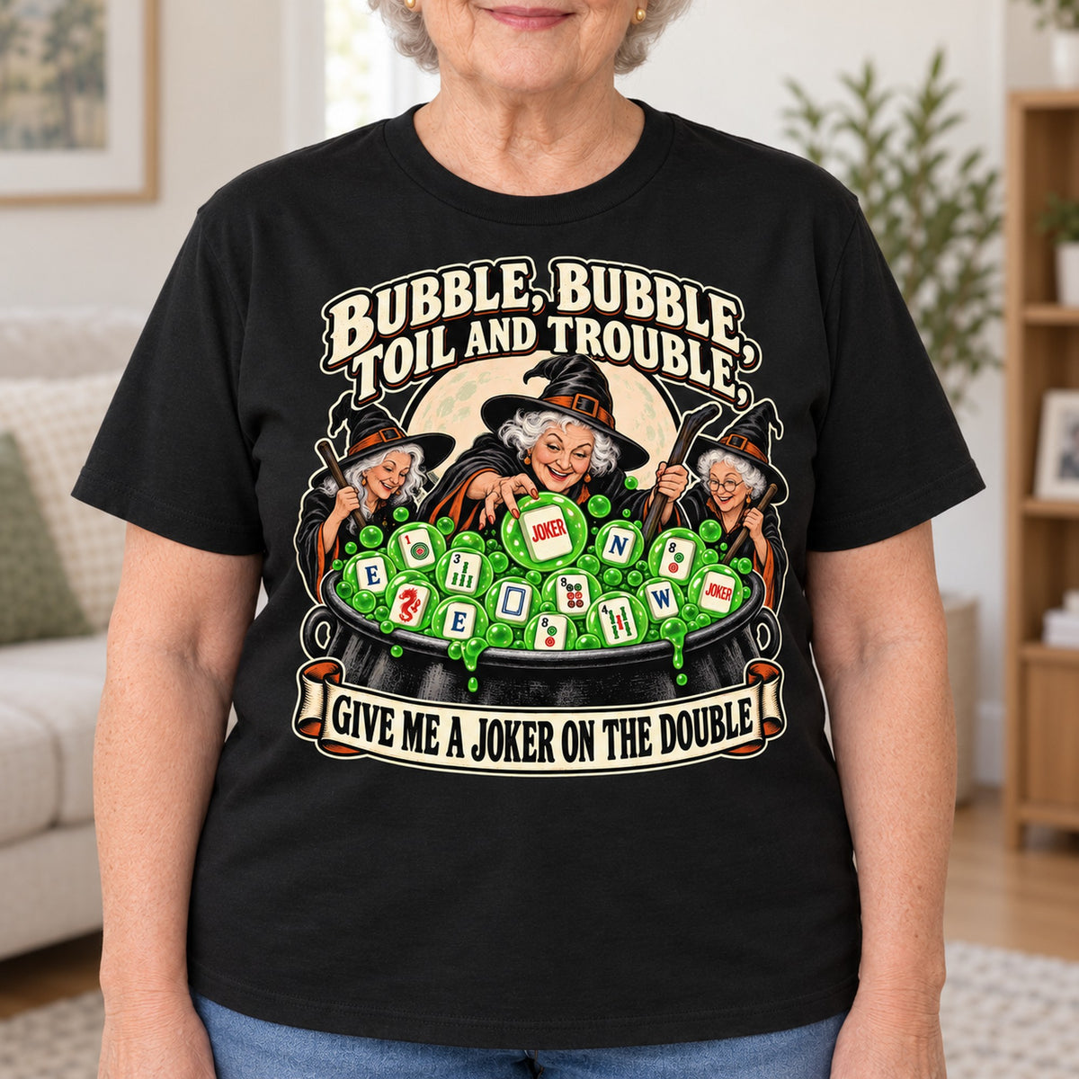 Toil And Trouble mahjong T-shirt in Black, close-up of the print, worn by Joyce. Joyce is 5′5″ and wears her usual size L. [bb c=black r=close]