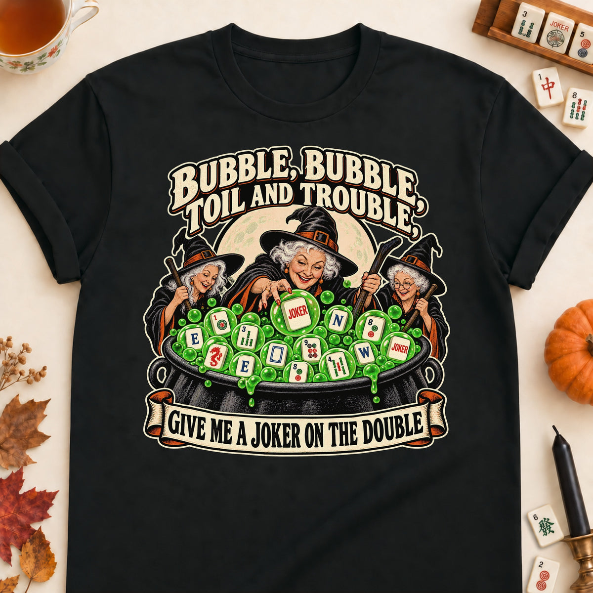 Toil And Trouble mahjong T-shirt in Black, laid flat. [bb c=black r=flat]