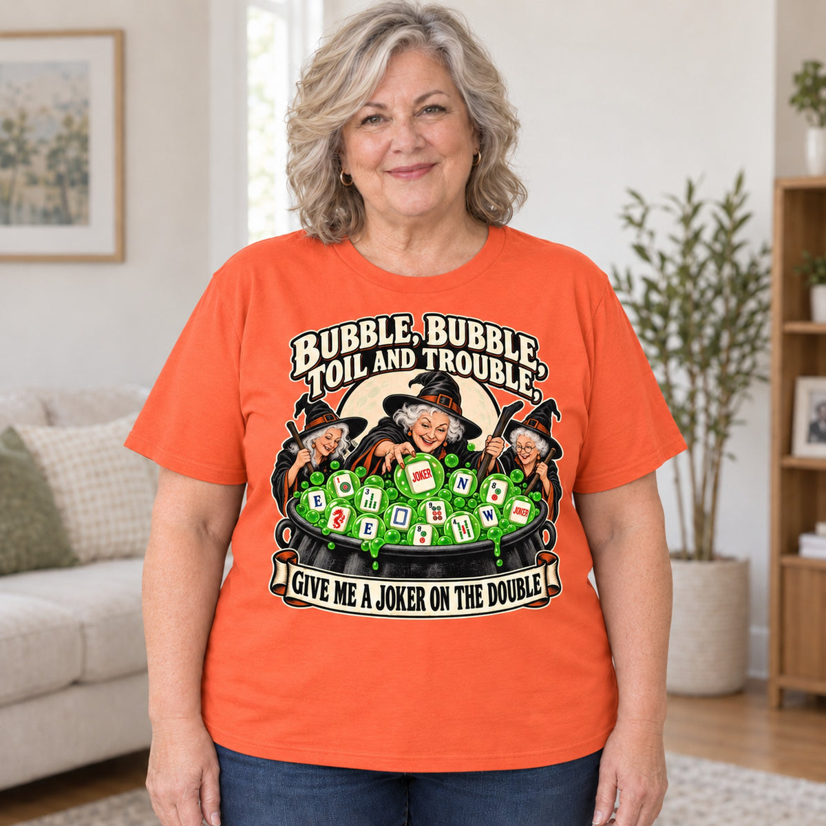 Toil And Trouble mahjong T-shirt in Orange, worn by Debra. Debra is 5′4″ and wears her usual size 2XL. [bb c=orange r=body2]