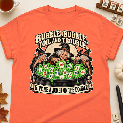 Toil And Trouble mahjong T-shirt in Orange, laid flat. [bb c=orange r=flat]