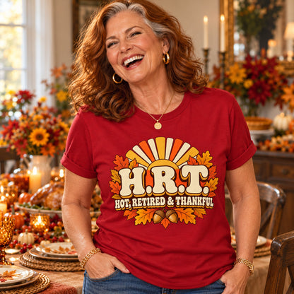 H.R.T. Hot, Retired & Thankful T-shirt in Cardinal Red, close-up of the print, worn by Patricia. Patricia is 5′5″ and wears her usual size L. [bb c=cardinal-red r=close]
