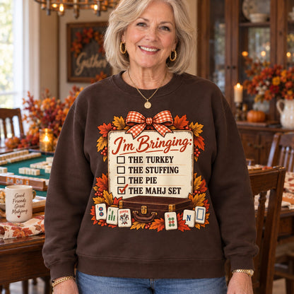 I'm Bringing The Mahj Set sweatshirt in Dark Chocolate, close-up of the print, worn by Elaine. Elaine is 5′5″ and wears her usual size M. [bb c=dark-chocolate r=close]