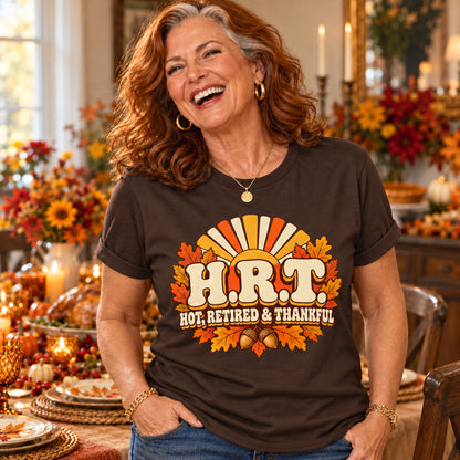 H.R.T. Hot, Retired & Thankful T-shirt in Dark Chocolate, close-up of the print, worn by Patricia. Patricia is 5′5″ and wears her usual size L. [bb c=dark-chocolate r=close]