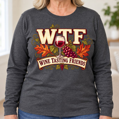 WTF Wine Tasting Friends long sleeve in Dark Heather, close-up of the print, worn by Patty. Patty is 5′5″ and wears her usual size XL. [bb c=dark-heather r=close]