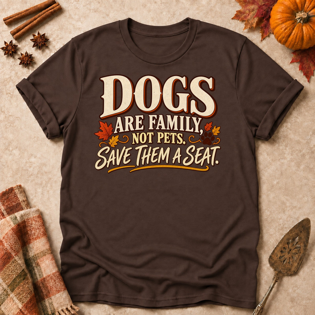 Dogs Are Family dog mom T-shirt in Dark Chocolate, laid flat. [bb c=dark-chocolate r=flat]