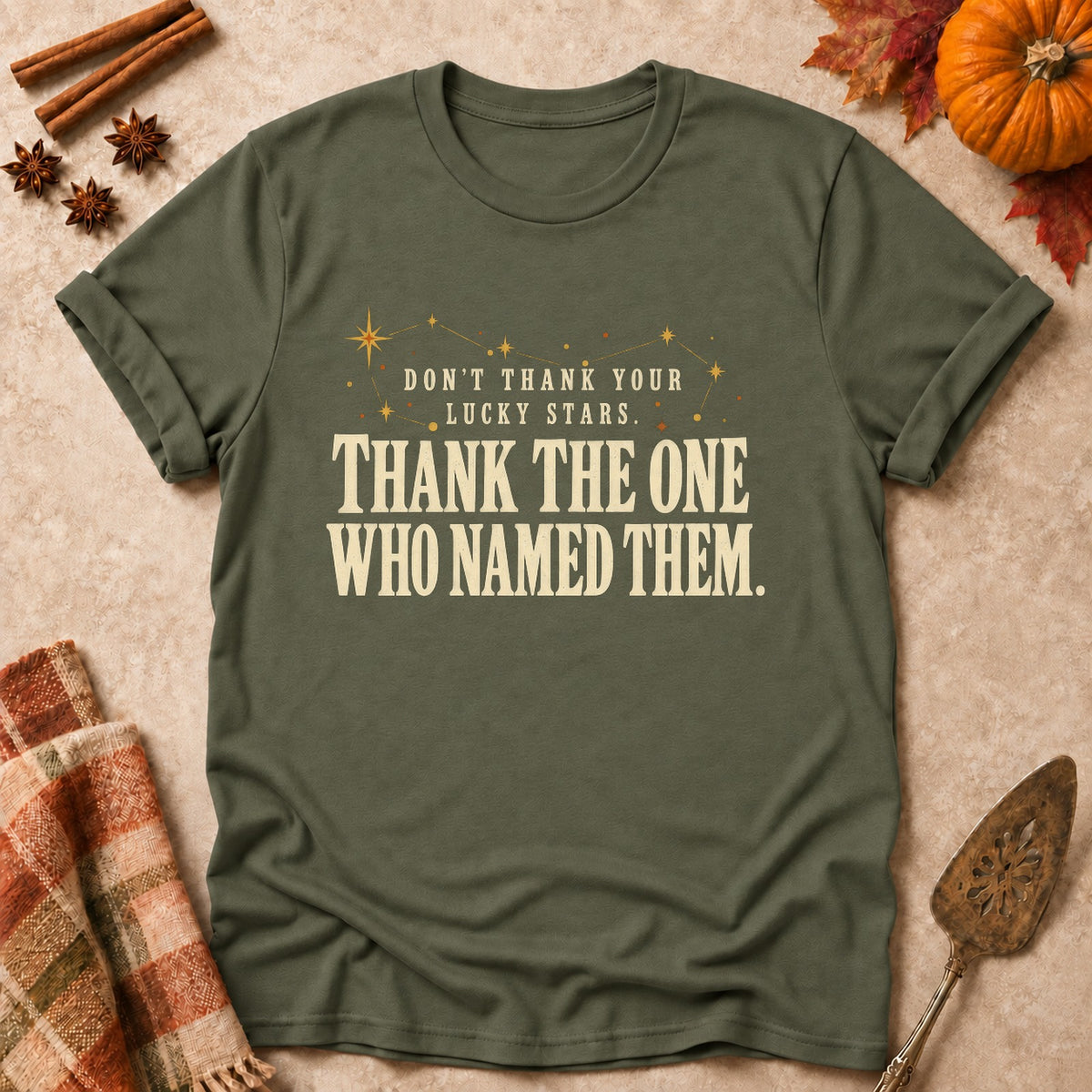 Thank The One Who Named Them faith T-shirt in Military Green, laid flat. [bb c=military-green r=flat]