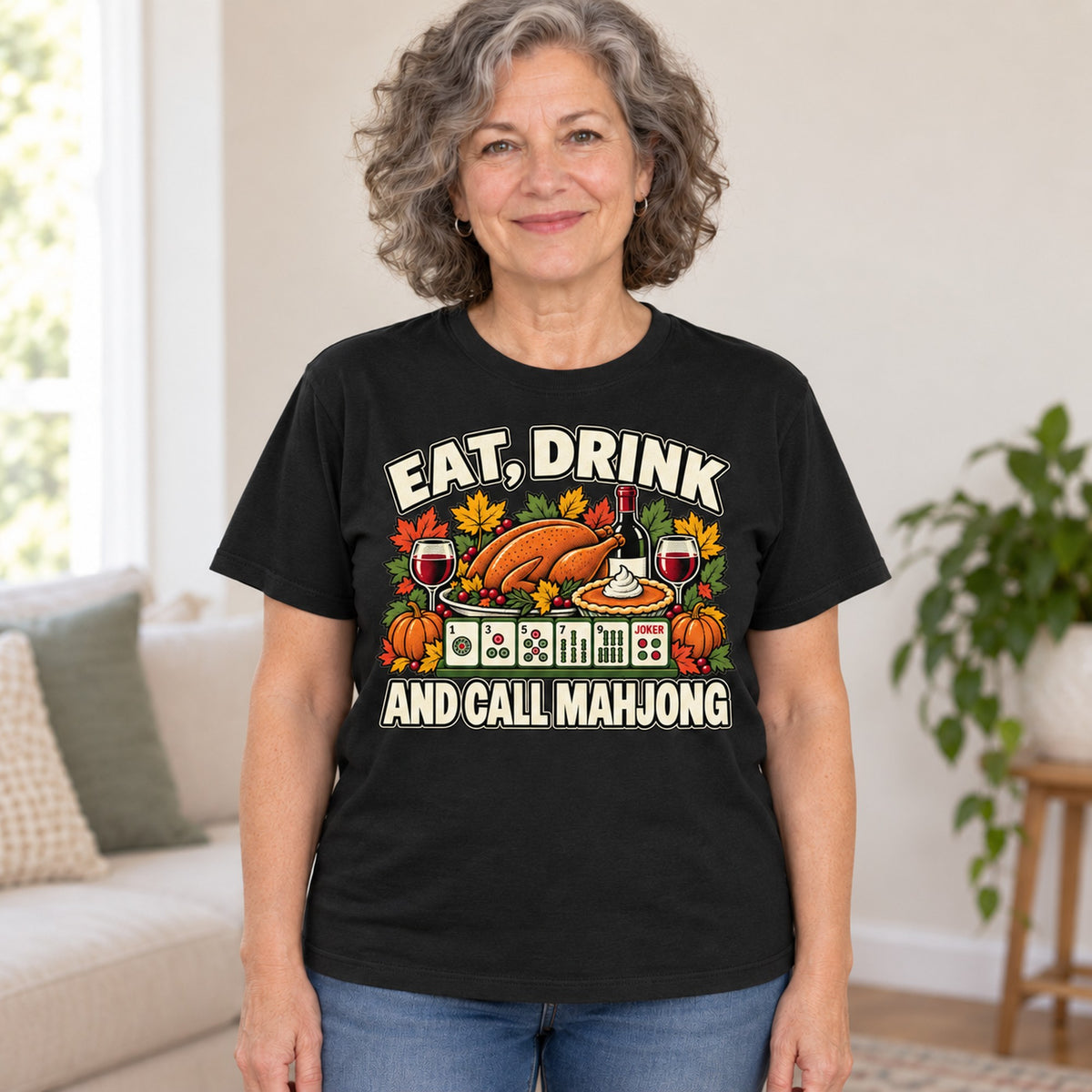 Eat, Drink And Call Mahjong T-shirt in Black, worn by Linda. Linda is 5′5″ and wears her usual size L. [bb c=black r=hero]
