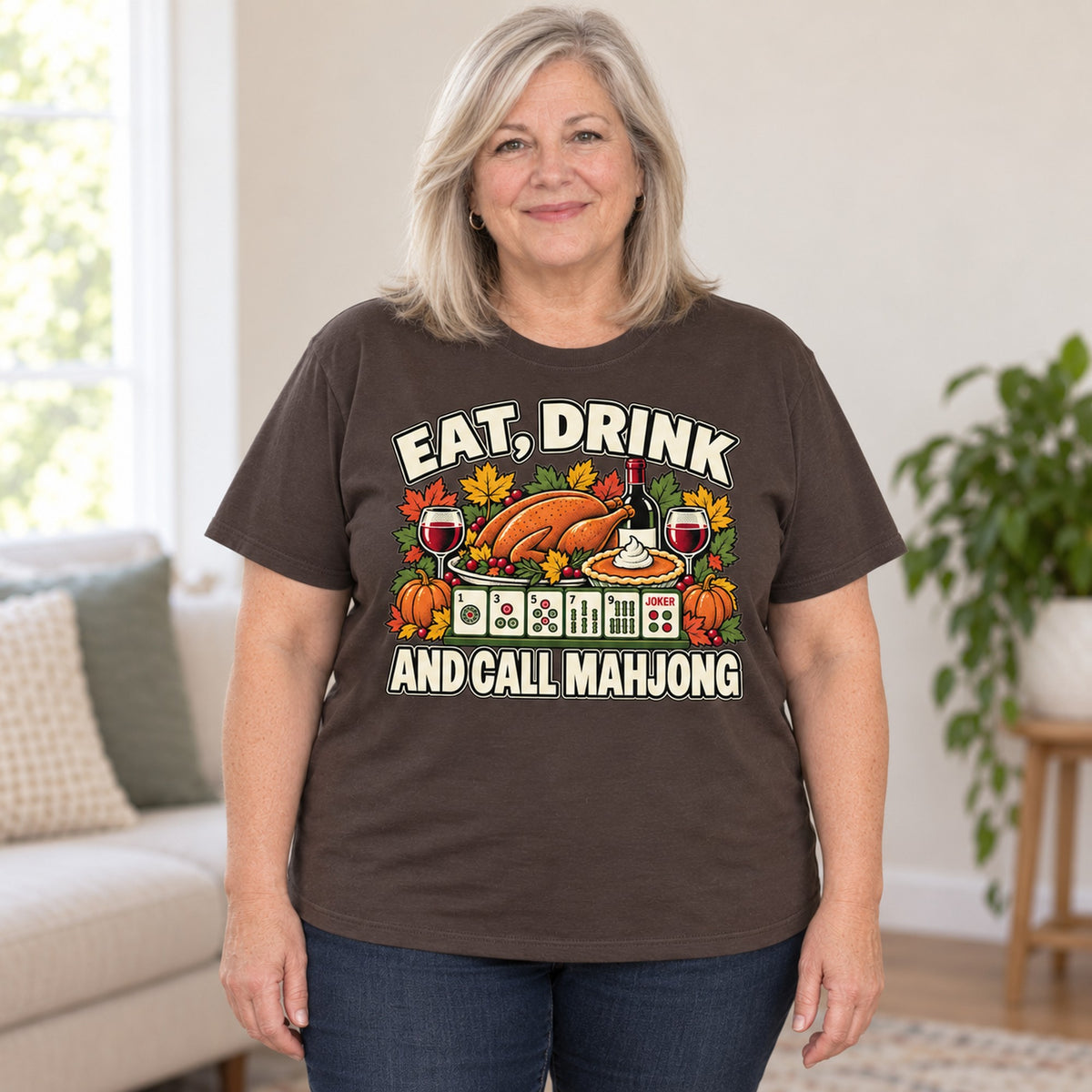 Eat, Drink And Call Mahjong T-shirt in Dark Chocolate, worn by Debra. Debra is 5′4″ and wears her usual size 2XL. [bb c=dark-chocolate r=body2]