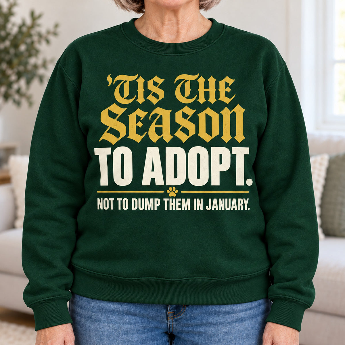 'Tis The Season To Adopt sweatshirt in Forest Green, close-up of the print, worn by Carol. Carol is 5′4″ and wears her usual size L. [bb c=forest-green r=close]