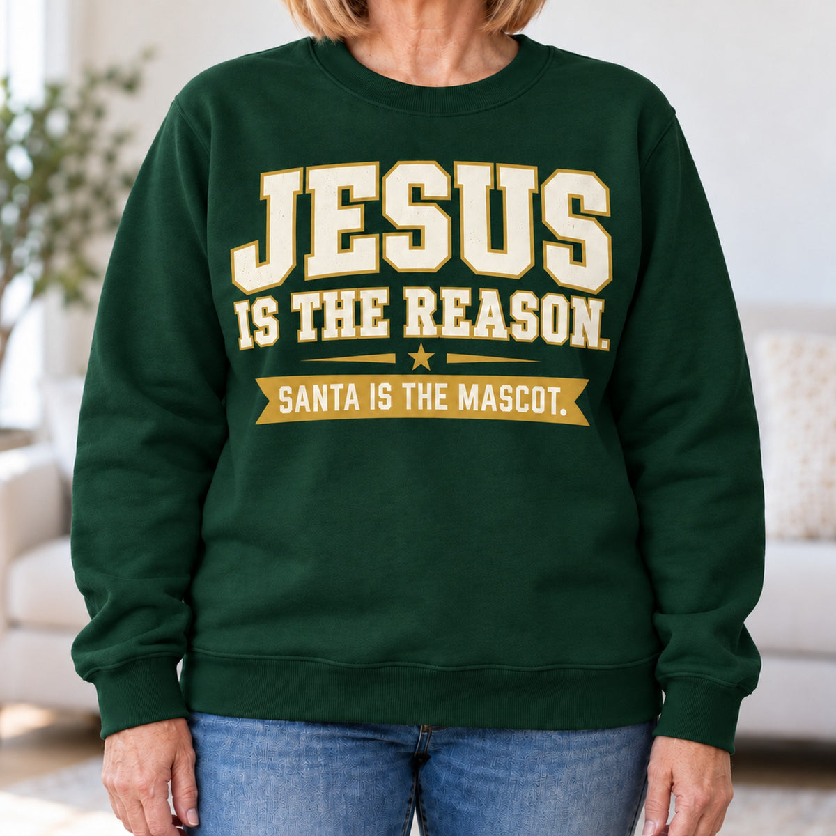 Jesus Is The Reason sweatshirt in Forest Green, close-up of the print, worn by Patty. Patty is 5′6″ and wears her usual size L. [bb c=forest-green r=close]