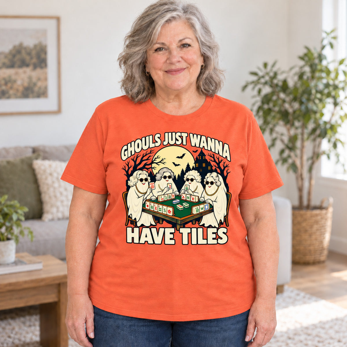 Ghouls Just Wanna Have Tiles mahjong T-shirt in Orange, worn by Debra. Debra is 5′4″ and wears her usual size 2XL. [bb c=orange r=body2]