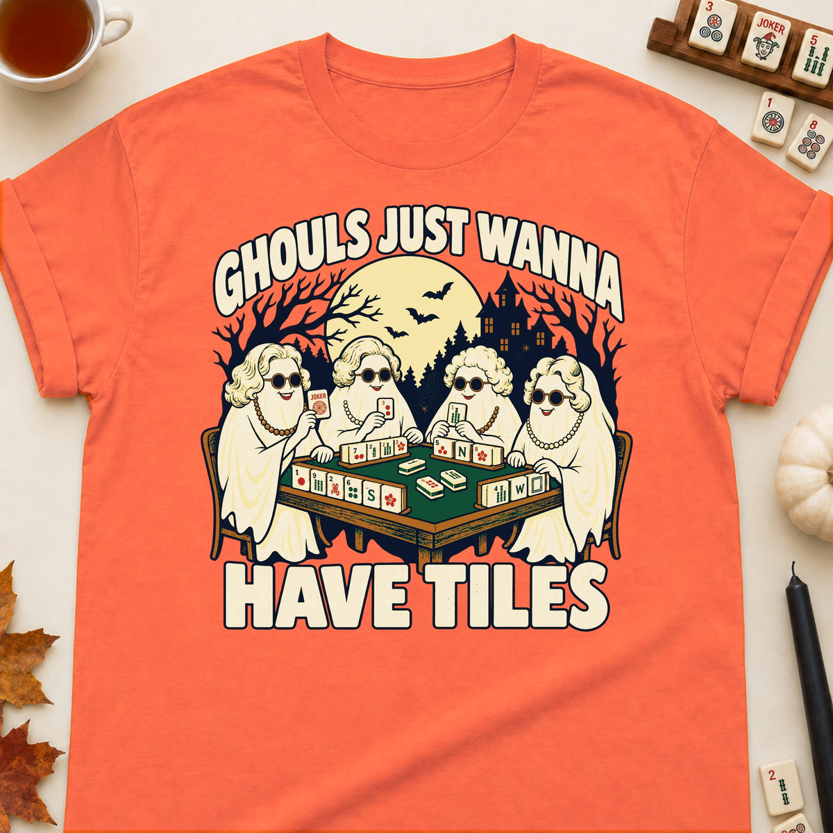 Ghouls Just Wanna Have Tiles mahjong T-shirt in Orange, laid flat. [bb c=orange r=flat]
