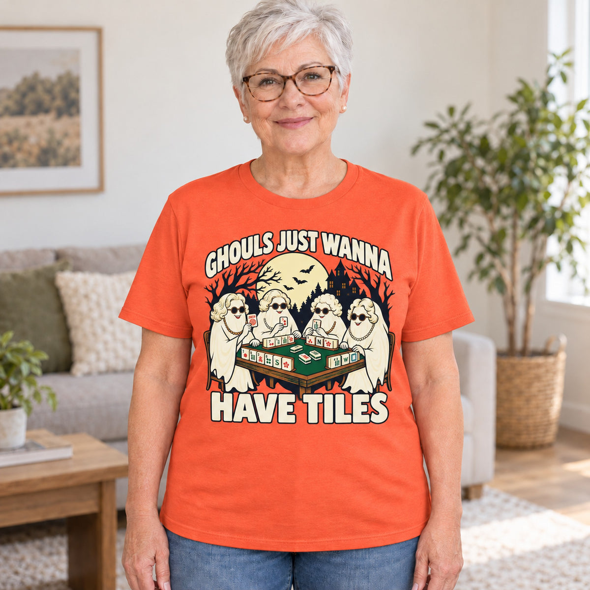 Ghouls Just Wanna Have Tiles mahjong T-shirt in Orange, worn by Judy. Judy is 5′5″ and wears her usual size L. [bb c=orange r=hero]