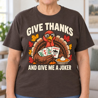 Give Thanks mahjong T-shirt in Dark Chocolate, close-up of the print, worn by Barbara. Barbara is 5′5″ and wears her usual size L. [bb c=dark-chocolate r=close]