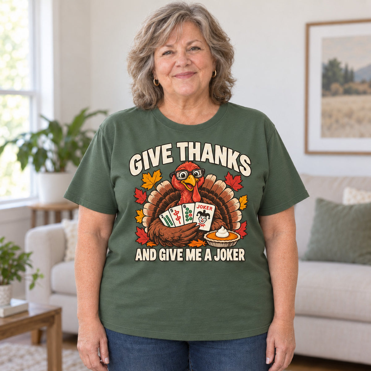 Give Thanks mahjong T-shirt in Military Green, worn by Debra. Debra is 5′4″ and wears her usual size 2XL. [bb c=military-green r=body2]