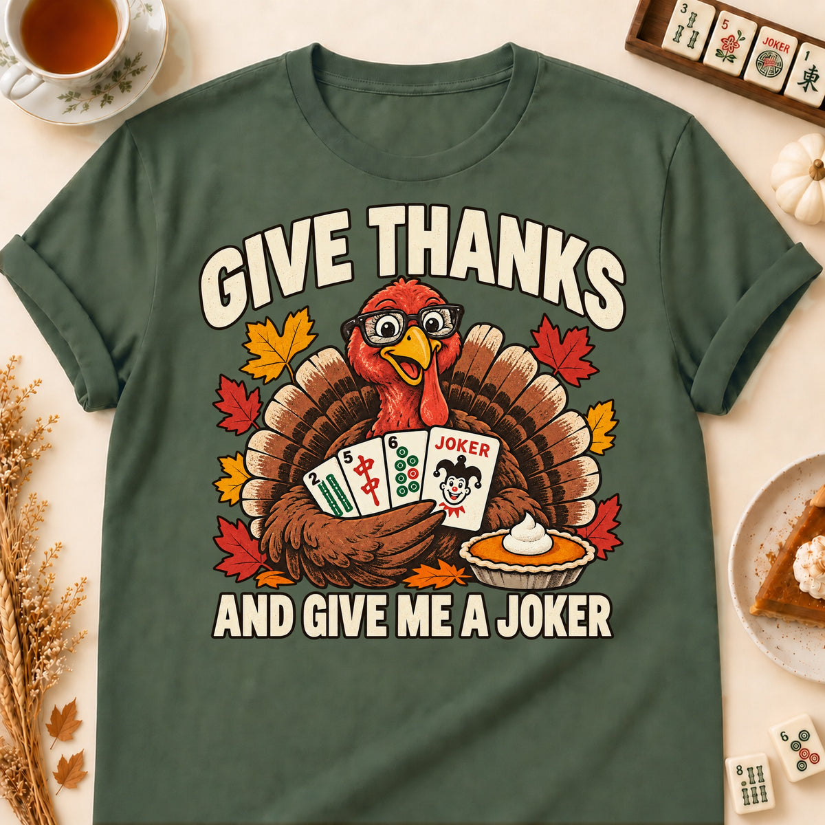 Give Thanks mahjong T-shirt in Military Green, laid flat. [bb c=military-green r=flat]