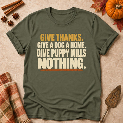 Give Puppy Mills Nothing dog mom T-shirt in Military Green, laid flat. [bb c=military-green r=flat]