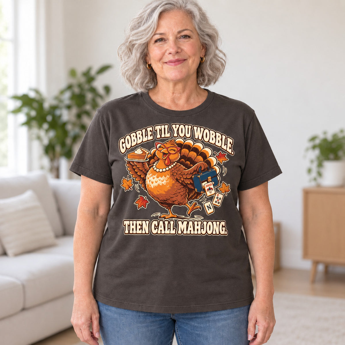 Gobble Til You Wobble mahjong T-shirt in Dark Chocolate, worn by Donna. Donna is 5′5″ and wears her usual size L. [bb c=dark-chocolate r=hero]