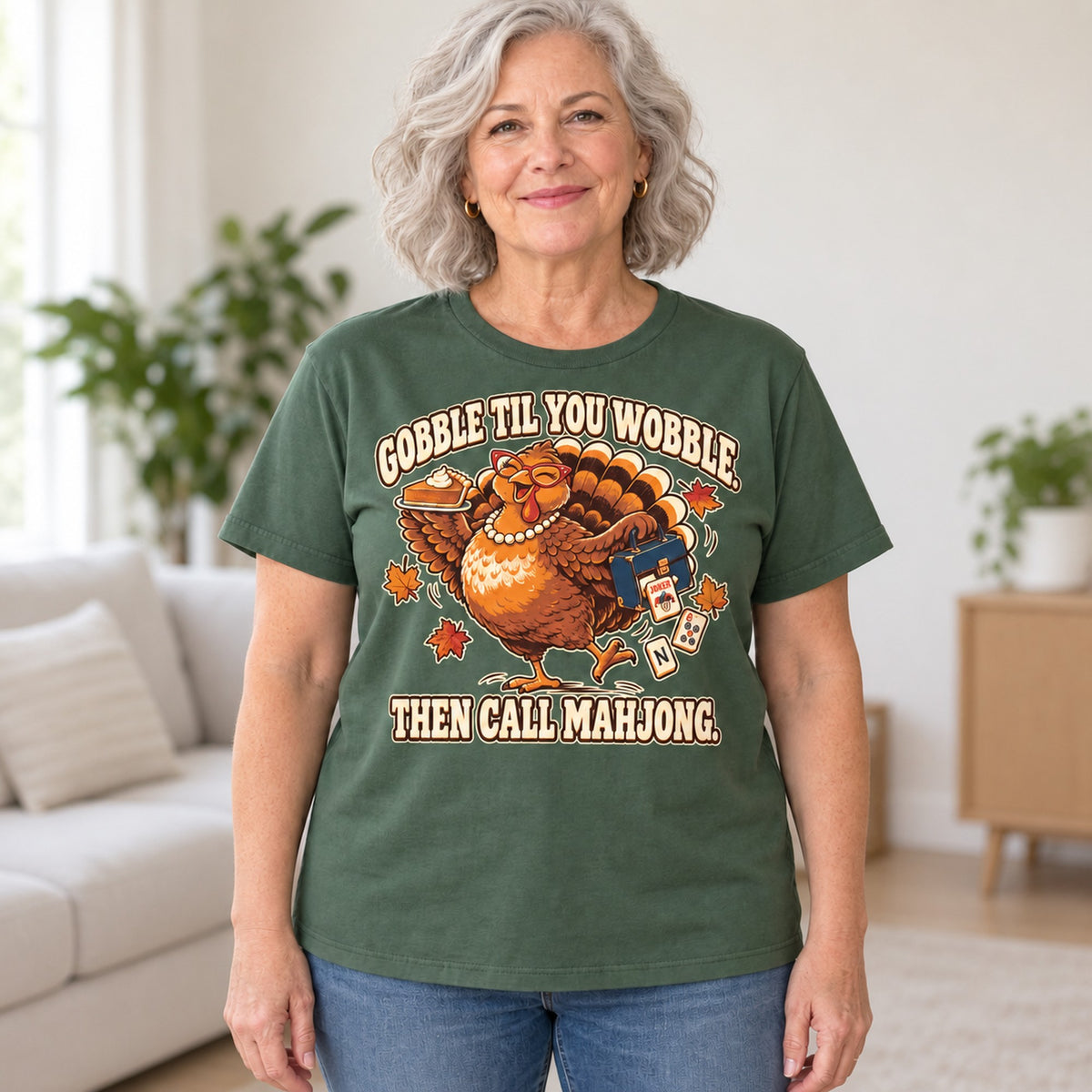 Gobble Til You Wobble mahjong T-shirt in Military Green, worn by Donna. Donna is 5′5″ and wears her usual size L. [bb c=military-green r=hero]