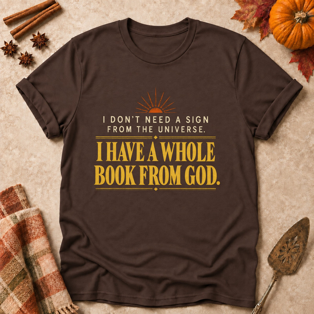 A Whole Book From God faith T-shirt in Dark Chocolate, laid flat. [bb c=dark-chocolate r=flat]