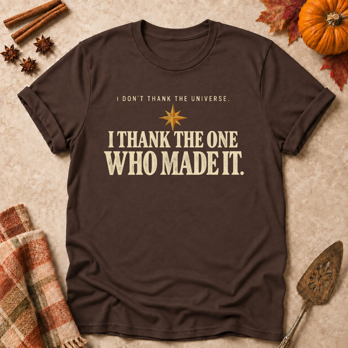 I Thank The One Who Made It faith T-shirt in Dark Chocolate, laid flat. [bb c=dark-chocolate r=flat]