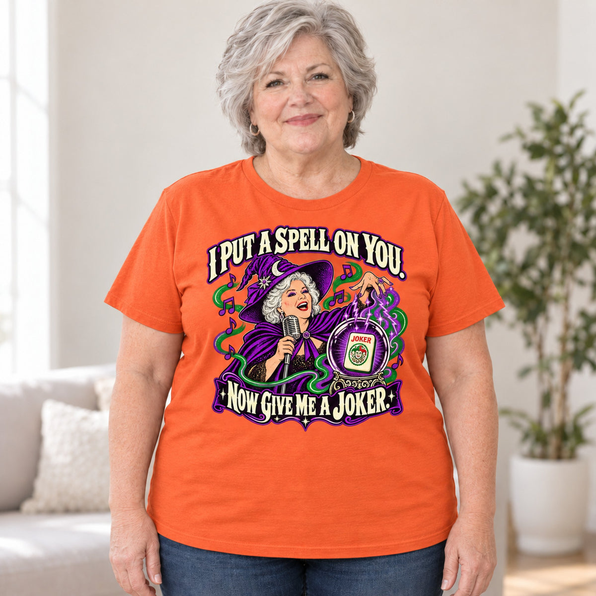 I Put A Spell On You mahjong T-shirt in Orange, worn by Debra. Debra is 5′4″ and wears her usual size 2XL. [bb c=orange r=body2]