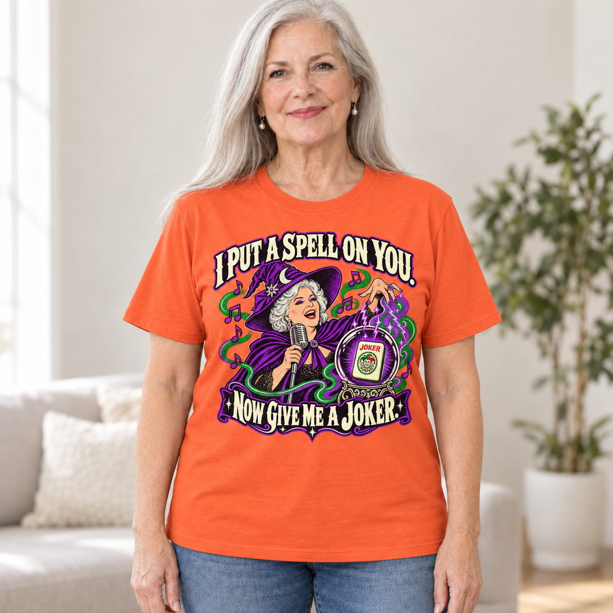I Put A Spell On You mahjong T-shirt in Orange, worn by Marilyn. Marilyn is 5′5″ and wears her usual size L. [bb c=orange r=hero]