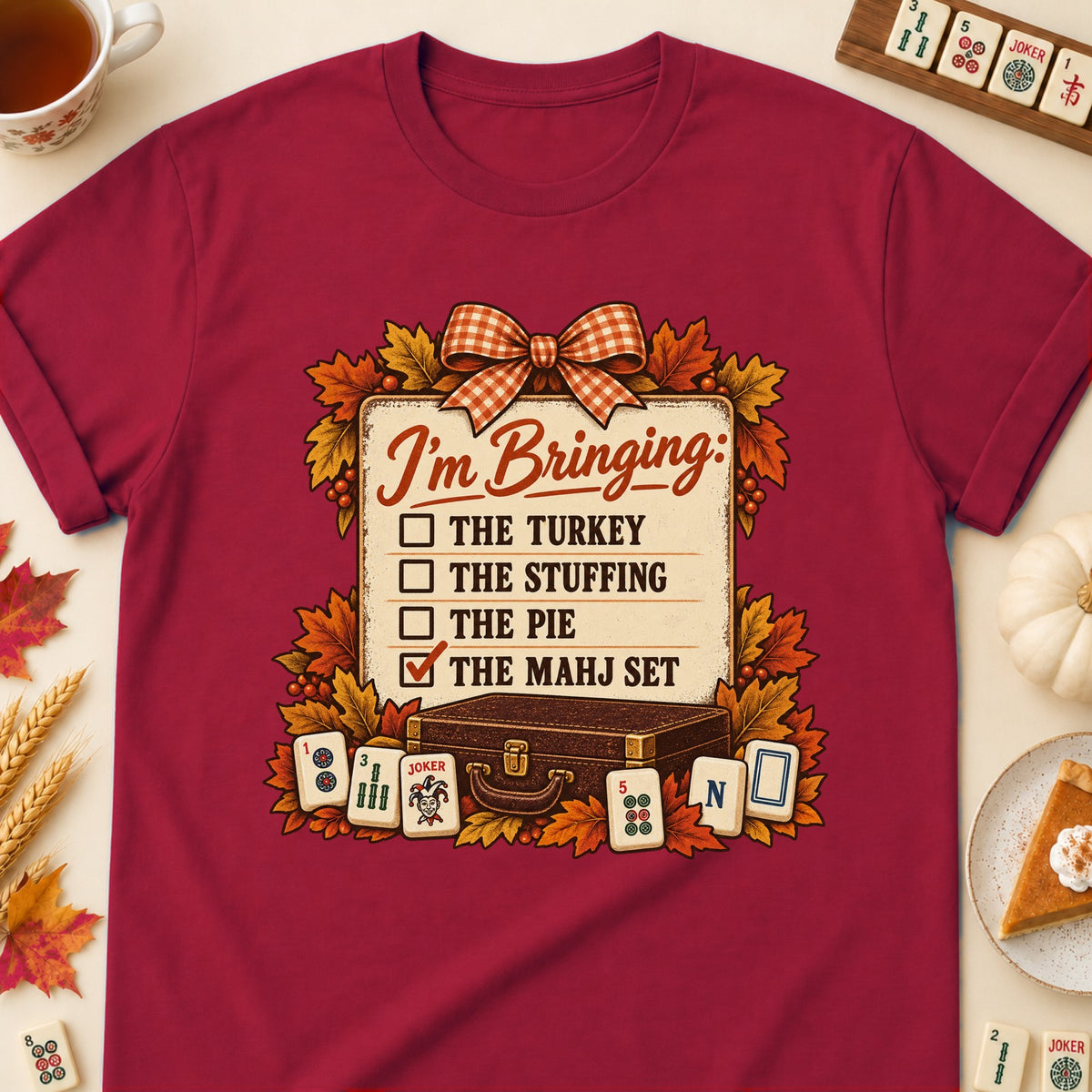 I'm Bringing mahjong T-shirt in Cardinal Red, laid flat. [bb c=cardinal-red r=flat]