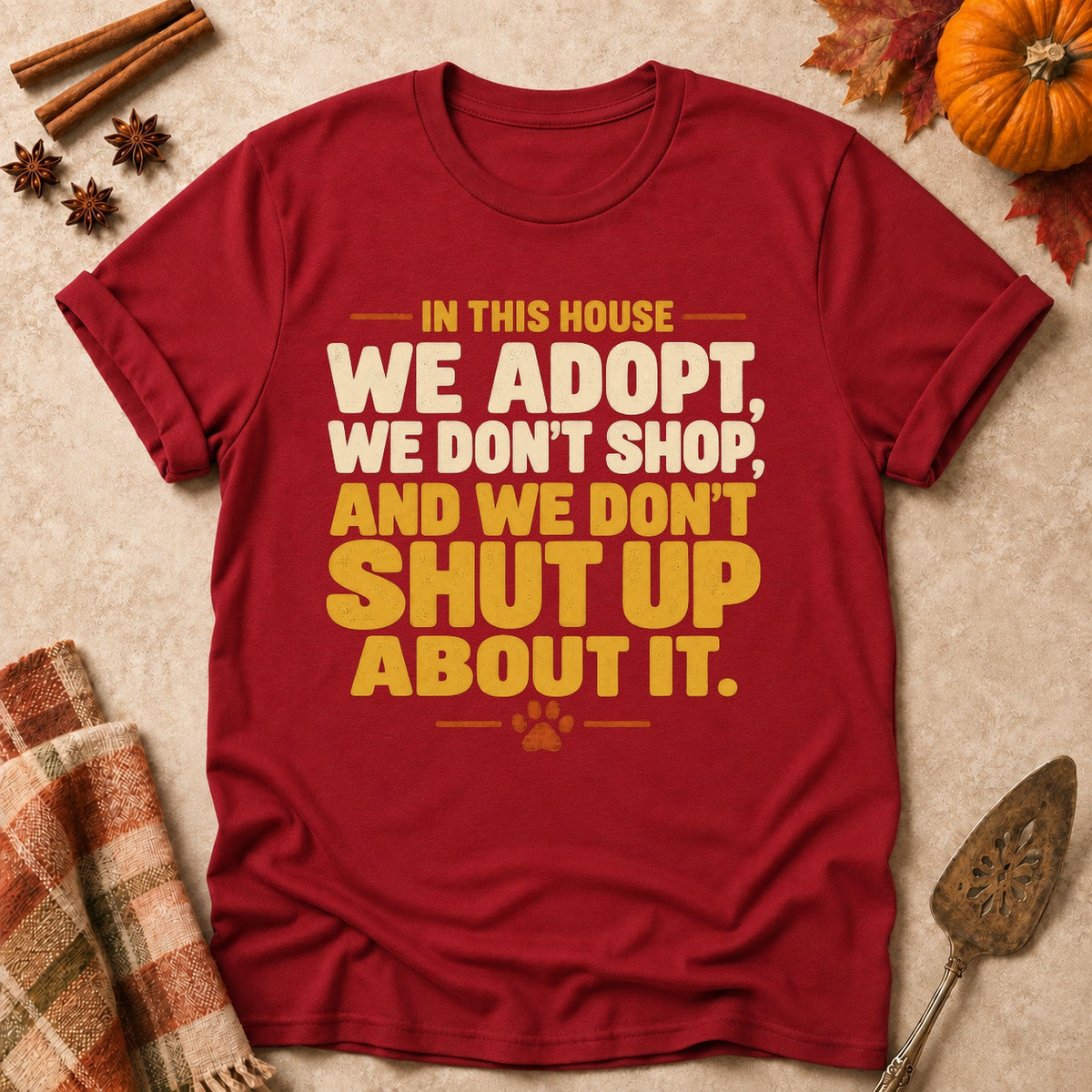 We Don't Shut Up About It dog mom T-shirt in Cardinal Red, laid flat. [bb c=cardinal-red r=flat]