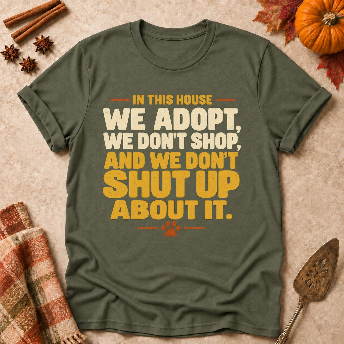 We Don't Shut Up About It dog mom T-shirt in Military Green, laid flat. [bb c=military-green r=flat]