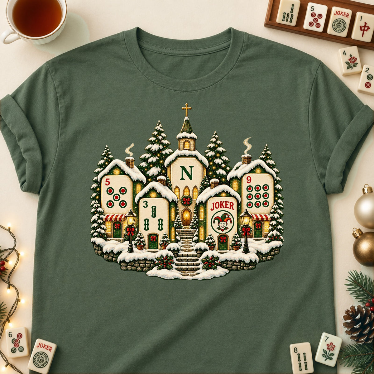 Christmas Village mahjong T-shirt in Military Green, laid flat. [bb c=military-green r=flat]