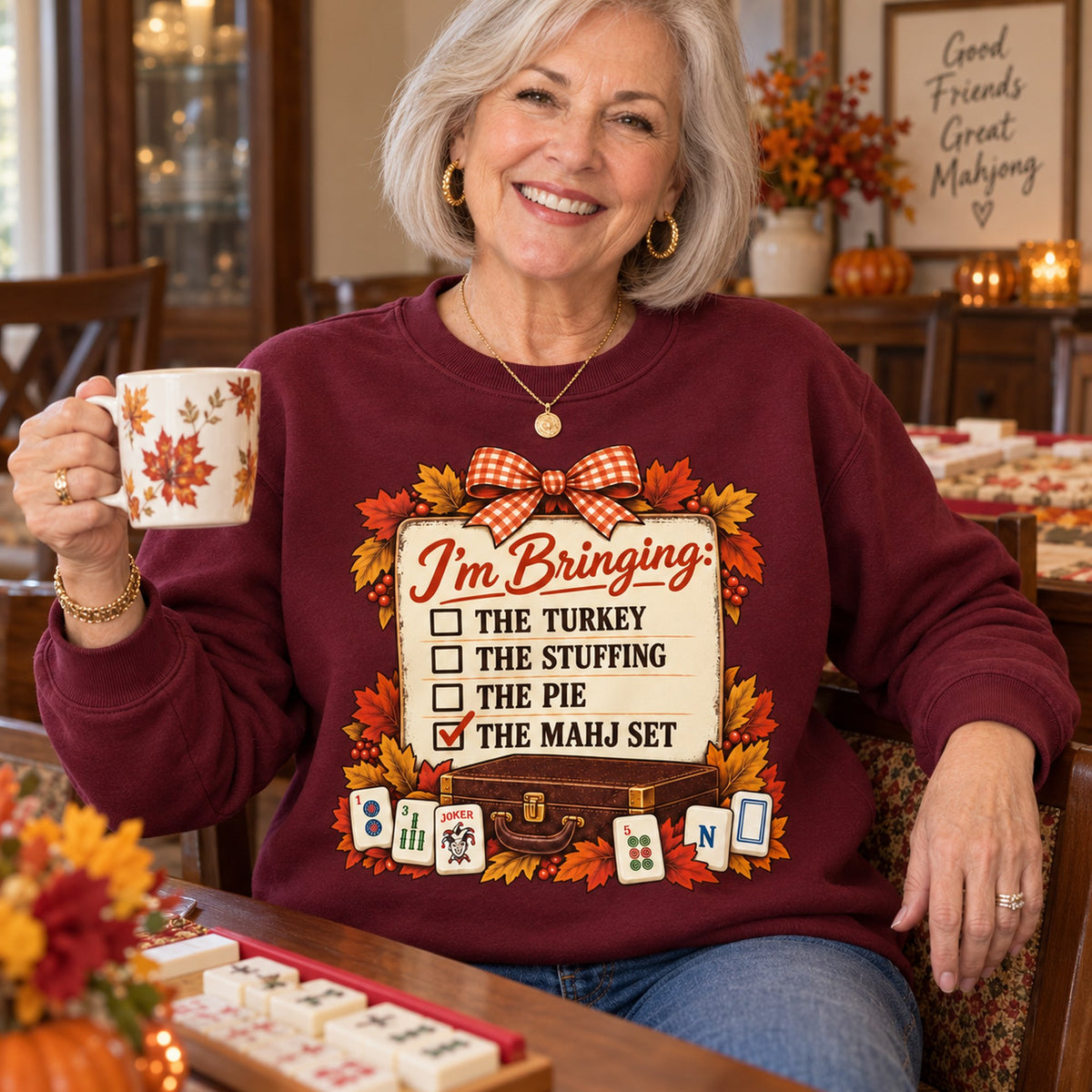 I'm Bringing The Mahj Set sweatshirt in Maroon, close-up of the print, worn by Elaine. Elaine is 5′5″ and wears her usual size M. [bb c=maroon r=close]