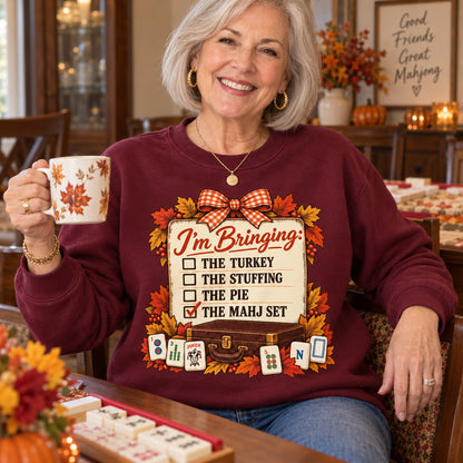 I'm Bringing The Mahj Set sweatshirt in Maroon, close-up of the print, worn by Elaine. Elaine is 5′5″ and wears her usual size M. [bb c=maroon r=close]