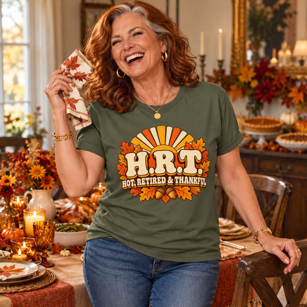 H.R.T. Hot, Retired & Thankful T-shirt in Military Green, worn by Patricia. Patricia is 5′5″ and wears her usual size L. [bb c=military-green r=hero]