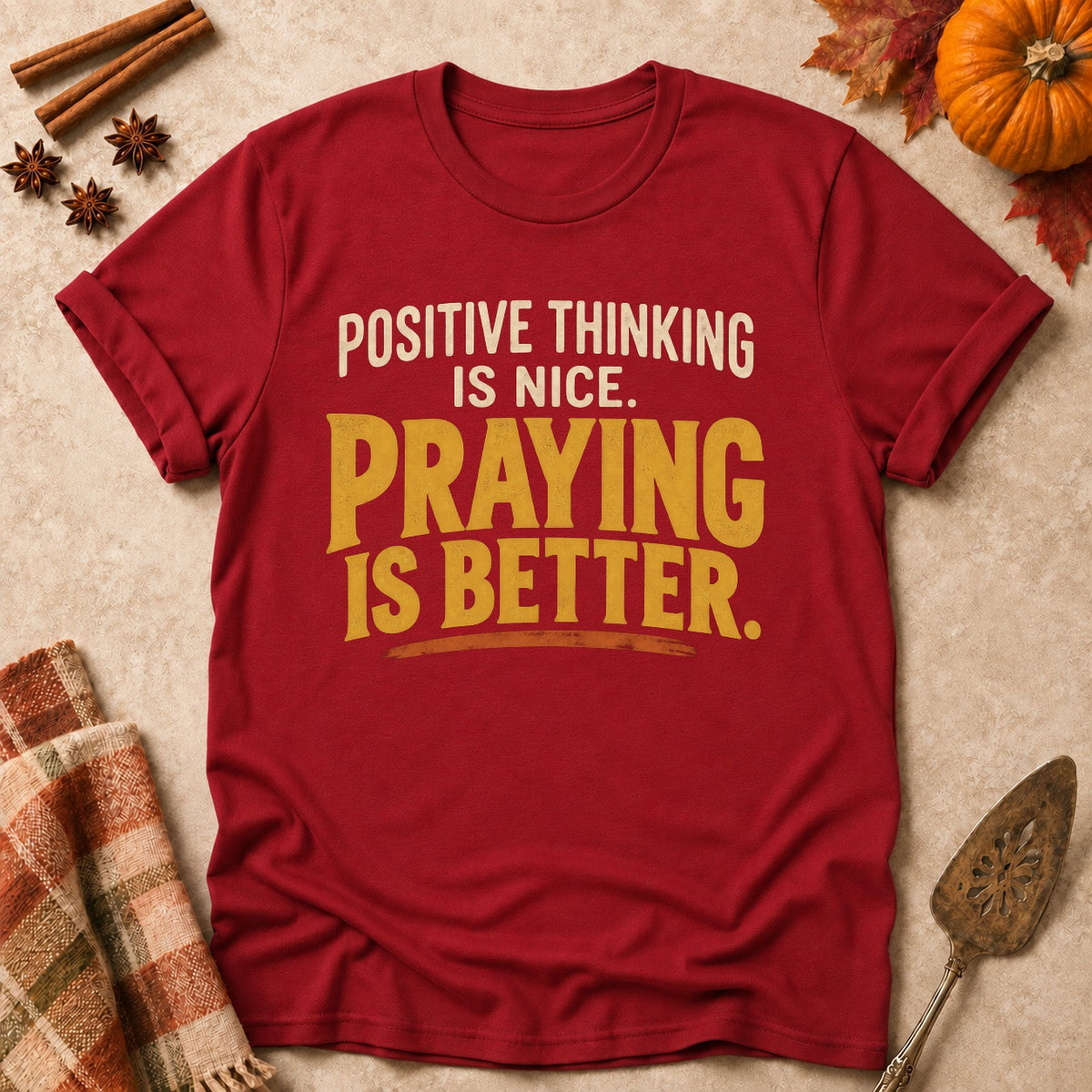 Praying Is Better faith T-shirt in Cardinal Red, laid flat. [bb c=cardinal-red r=flat]