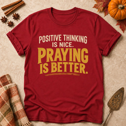Praying Is Better faith T-shirt in Cardinal Red, laid flat. [bb c=cardinal-red r=flat]