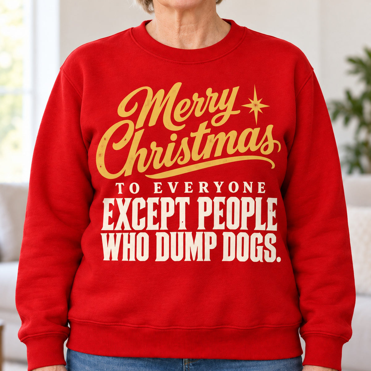 Merry Christmas Except People Who Dump Dogs sweatshirt in Red, close-up of the print, worn by Nancy. Nancy is 5′5″ and wears her usual size L. [bb c=red r=close]