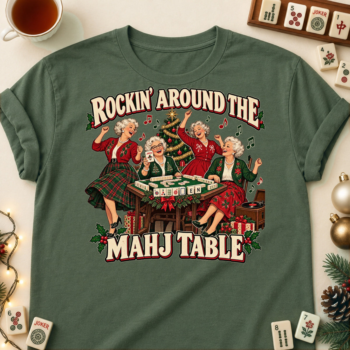 Rockin' Around The Mahj Table mahjong T-shirt in Military Green, laid flat. [bb c=military-green r=flat]