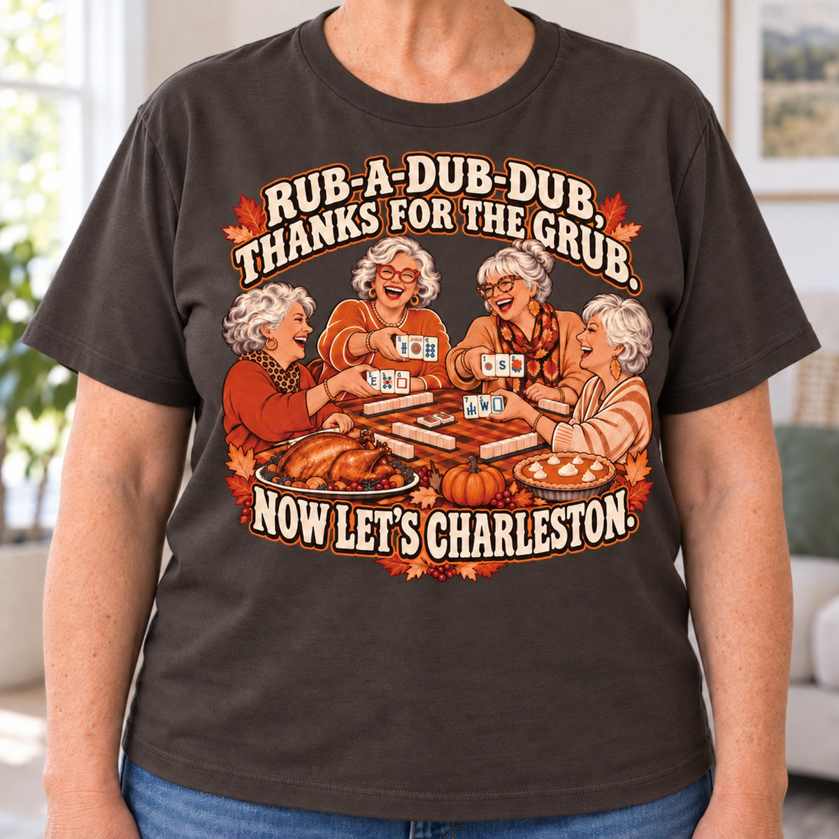 Rub-A-Dub-Dub mahjong T-shirt in Dark Chocolate, close-up of the print, worn by Brenda. Brenda is 5′5″ and wears her usual size L. [bb c=dark-chocolate r=close]