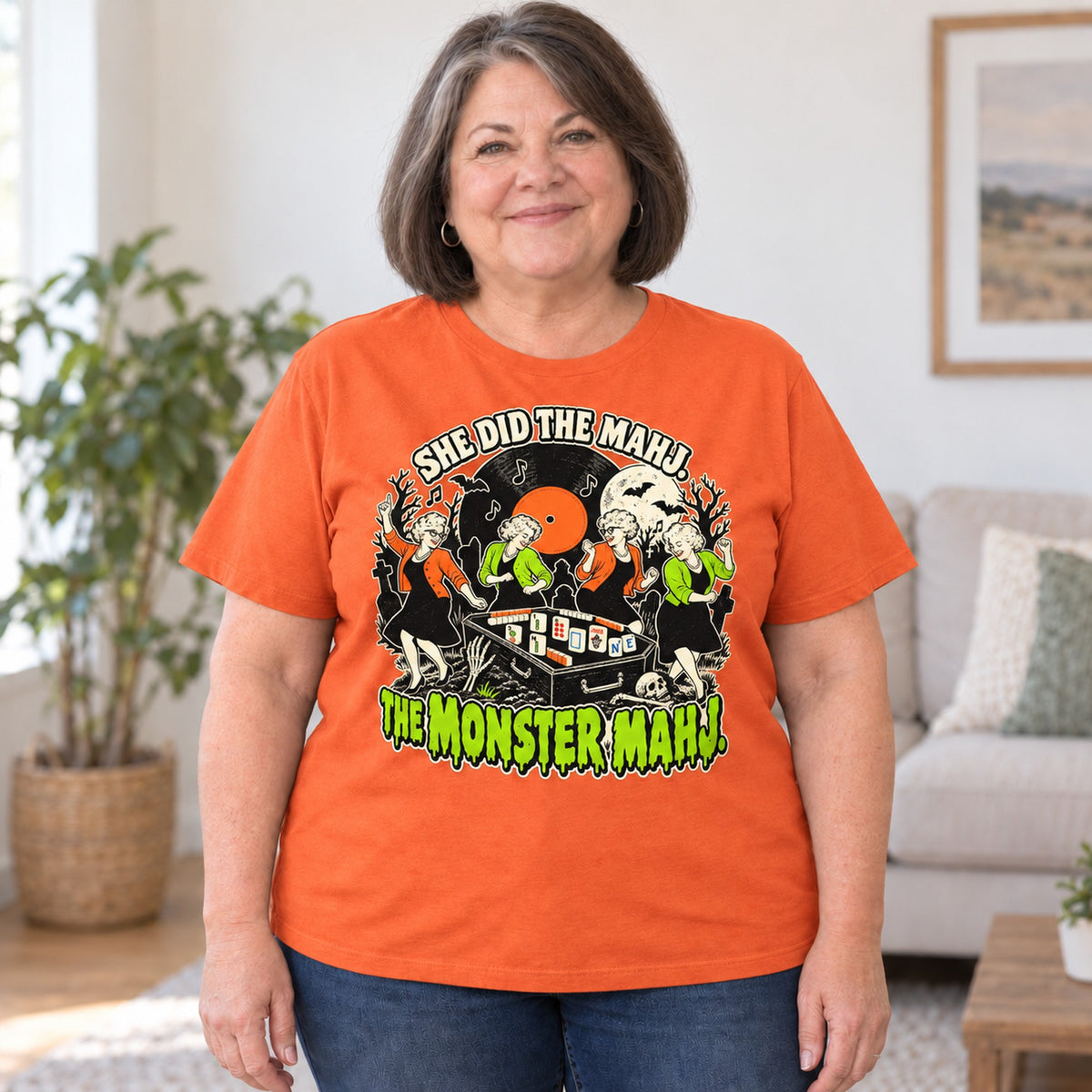 Monster Mahj mahjong T-shirt in Orange, worn by Debra. Debra is 5′4″ and wears her usual size 2XL. [bb c=orange r=body2]