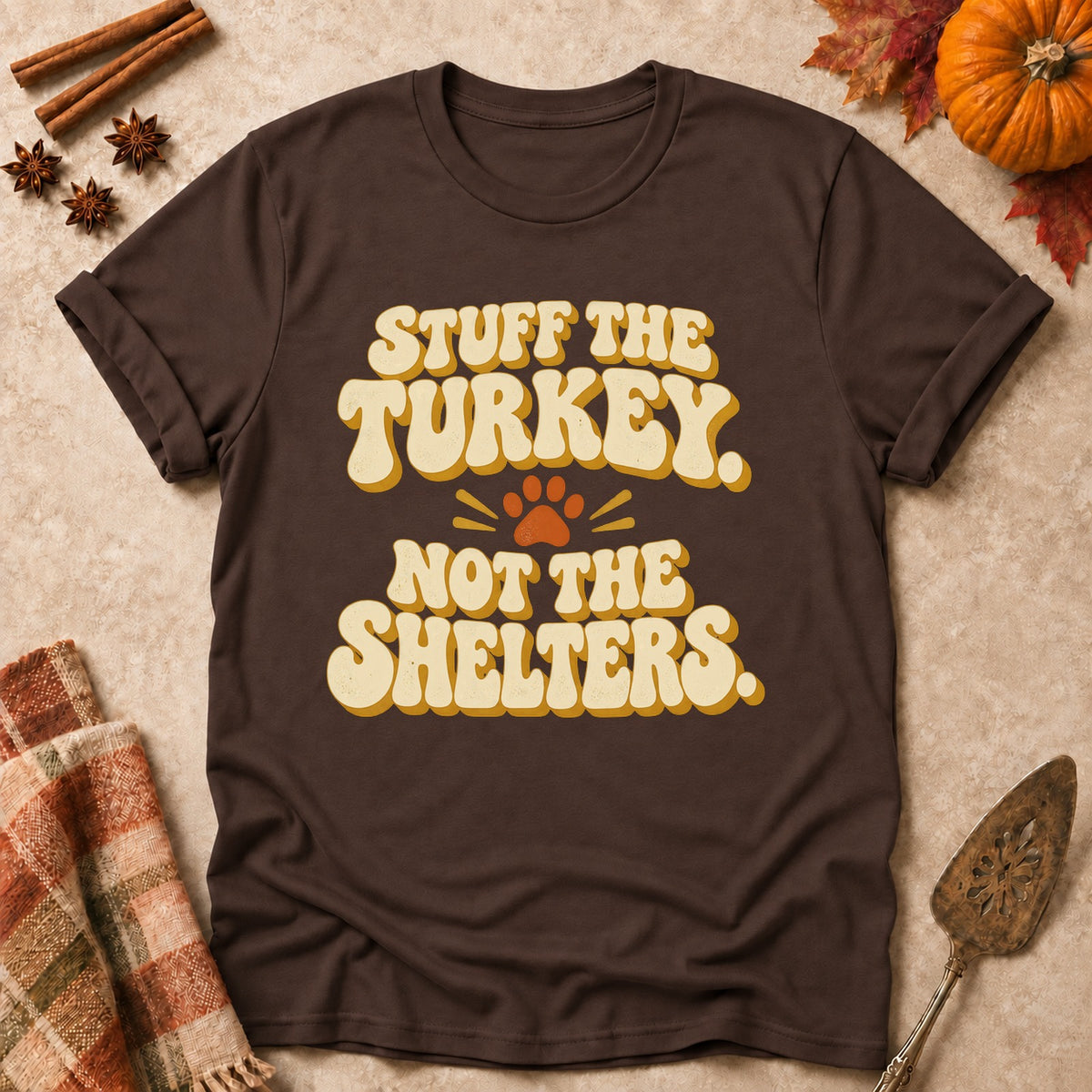 Stuff The Turkey, Not The Shelters dog mom T-shirt in Dark Chocolate, laid flat. [bb c=dark-chocolate r=flat]