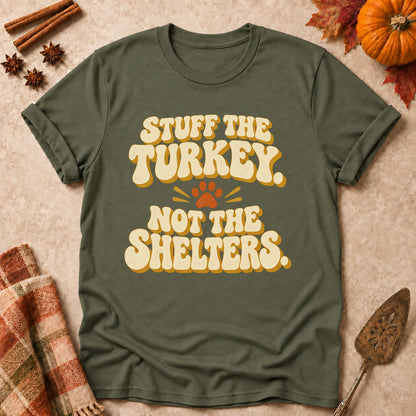 Stuff The Turkey, Not The Shelters dog mom T-shirt in Military Green, laid flat. [bb c=military-green r=flat]