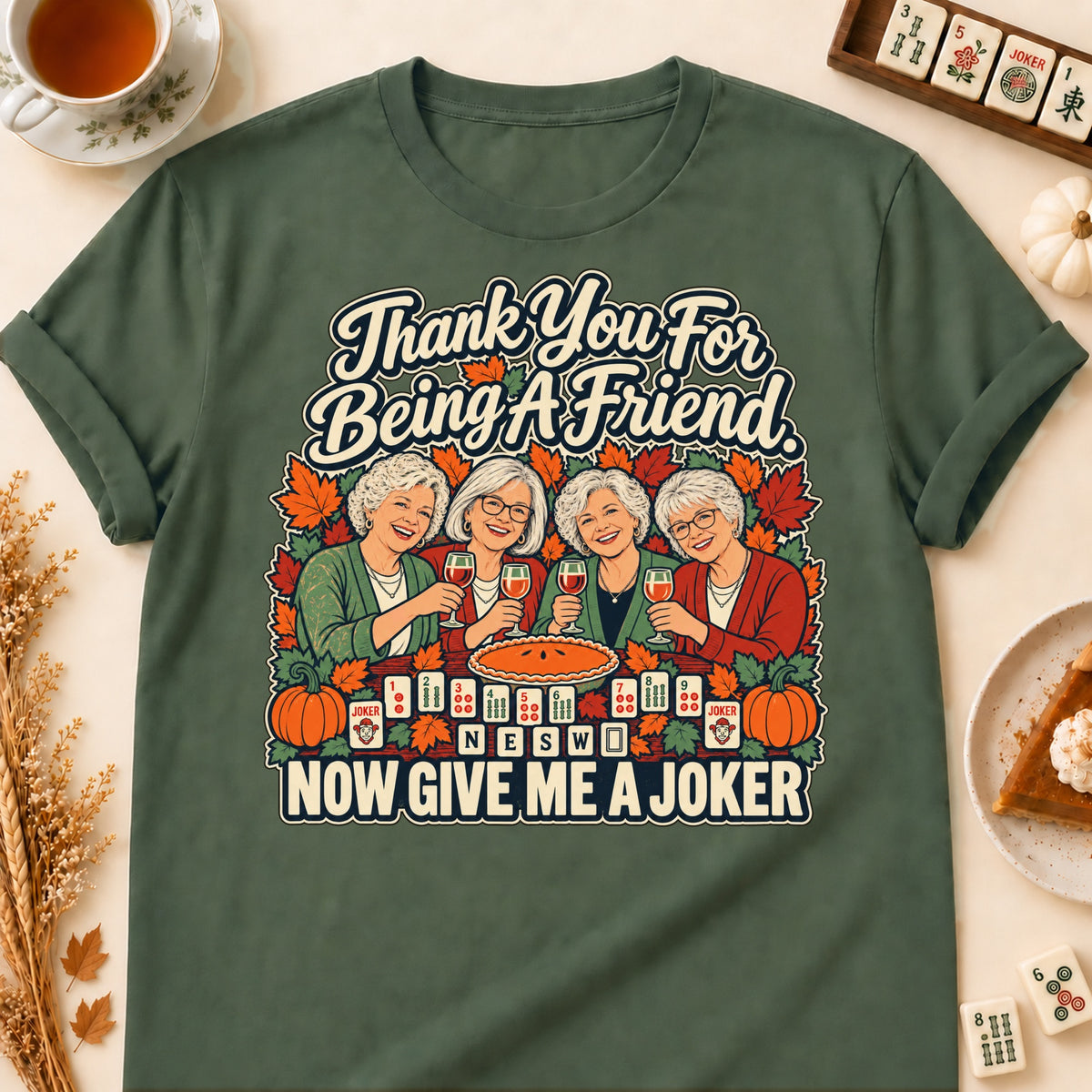 Thank You For Being A Friend mahjong T-shirt in Military Green, laid flat. [bb c=military-green r=flat]
