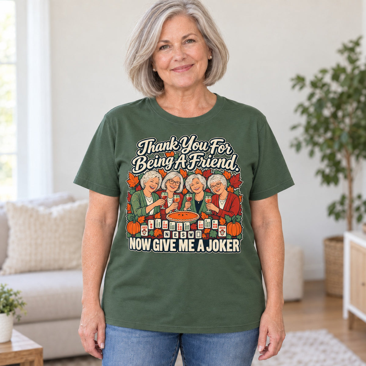 Thank You For Being A Friend mahjong T-shirt in Military Green, worn by Lorraine. Lorraine is 5′5″ and wears her usual size L. [bb c=military-green r=hero]