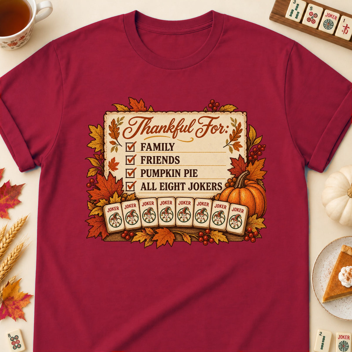 Thankful For mahjong T-shirt in Cardinal Red, laid flat. [bb c=cardinal-red r=flat]