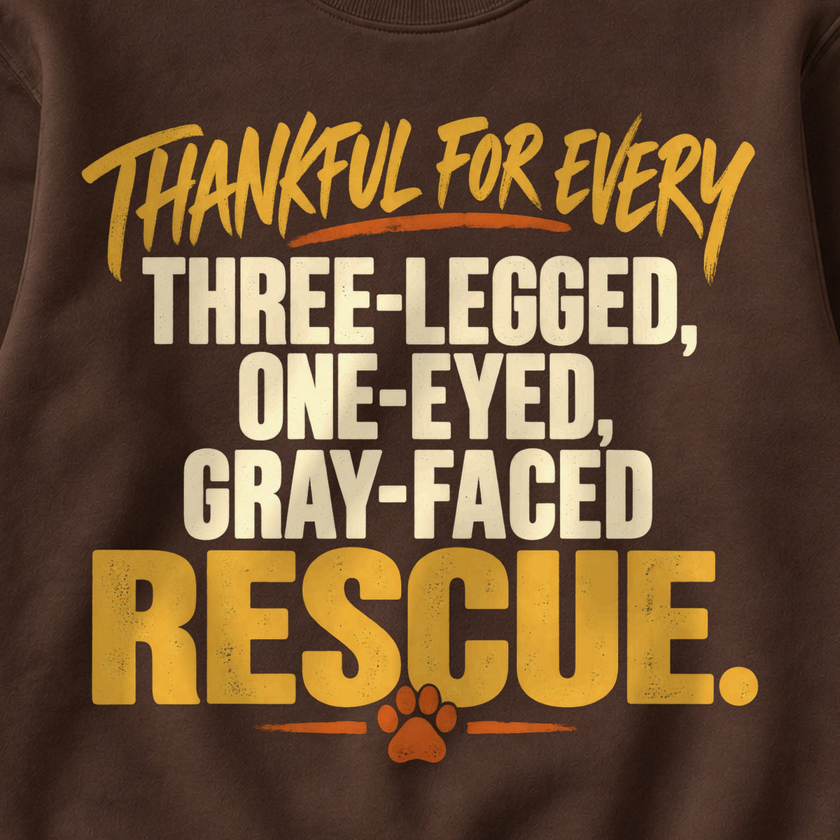 Thankful For Every Three-Legged, One-Eyed, Gray-Faced Rescue. Colored Print Sweatshirt in Dark Chocolate — design detail