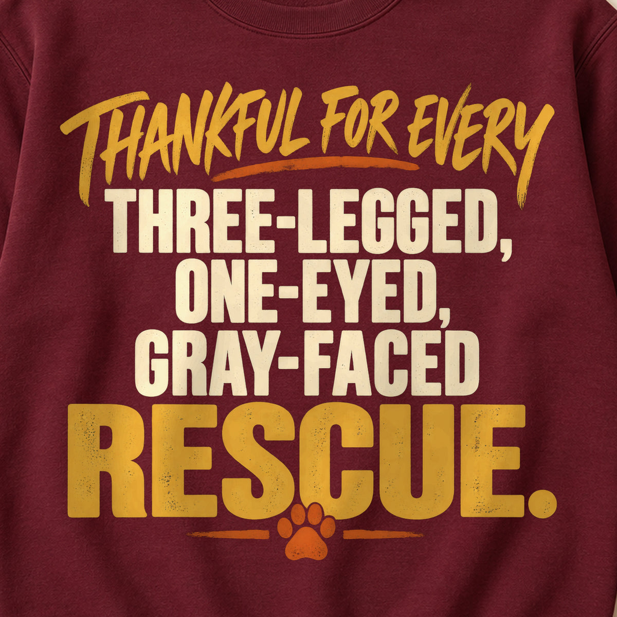 Thankful For Every Three-Legged, One-Eyed, Gray-Faced Rescue. Colored Print Sweatshirt in Maroon — design detail