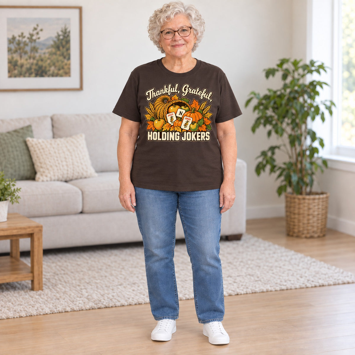 Thankful, Grateful, Holding Jokers mahjong T-shirt in Dark Chocolate, full length, worn by Barbara. Barbara is 5′5″ and wears her usual size L. [bb c=dark-chocolate r=fit]