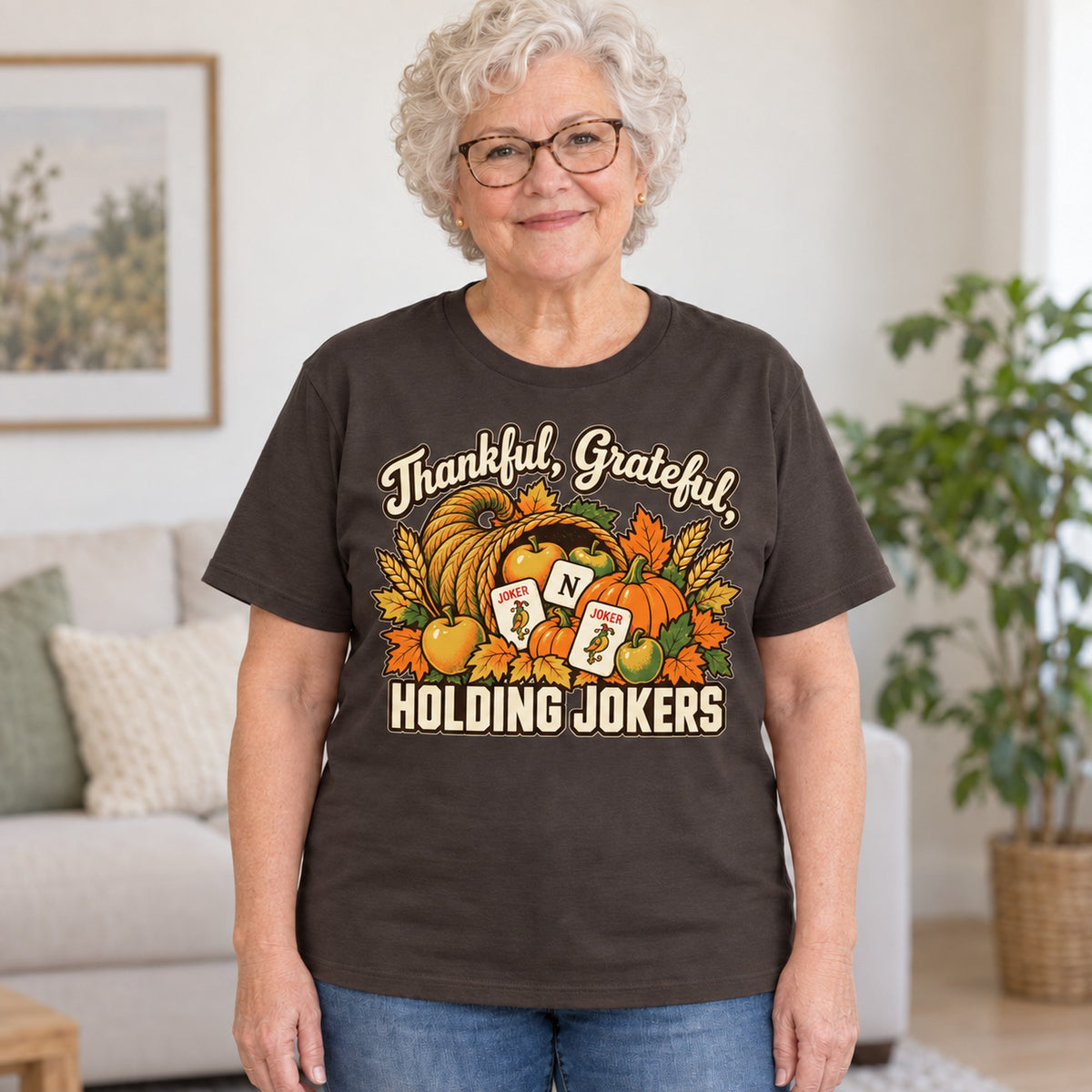 Thankful, Grateful, Holding Jokers mahjong T-shirt in Dark Chocolate, worn by Barbara. Barbara is 5′5″ and wears her usual size L. [bb c=dark-chocolate r=hero]