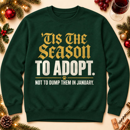 'Tis The Season To Adopt sweatshirt in Forest Green, laid flat. [bb c=forest-green r=flat]